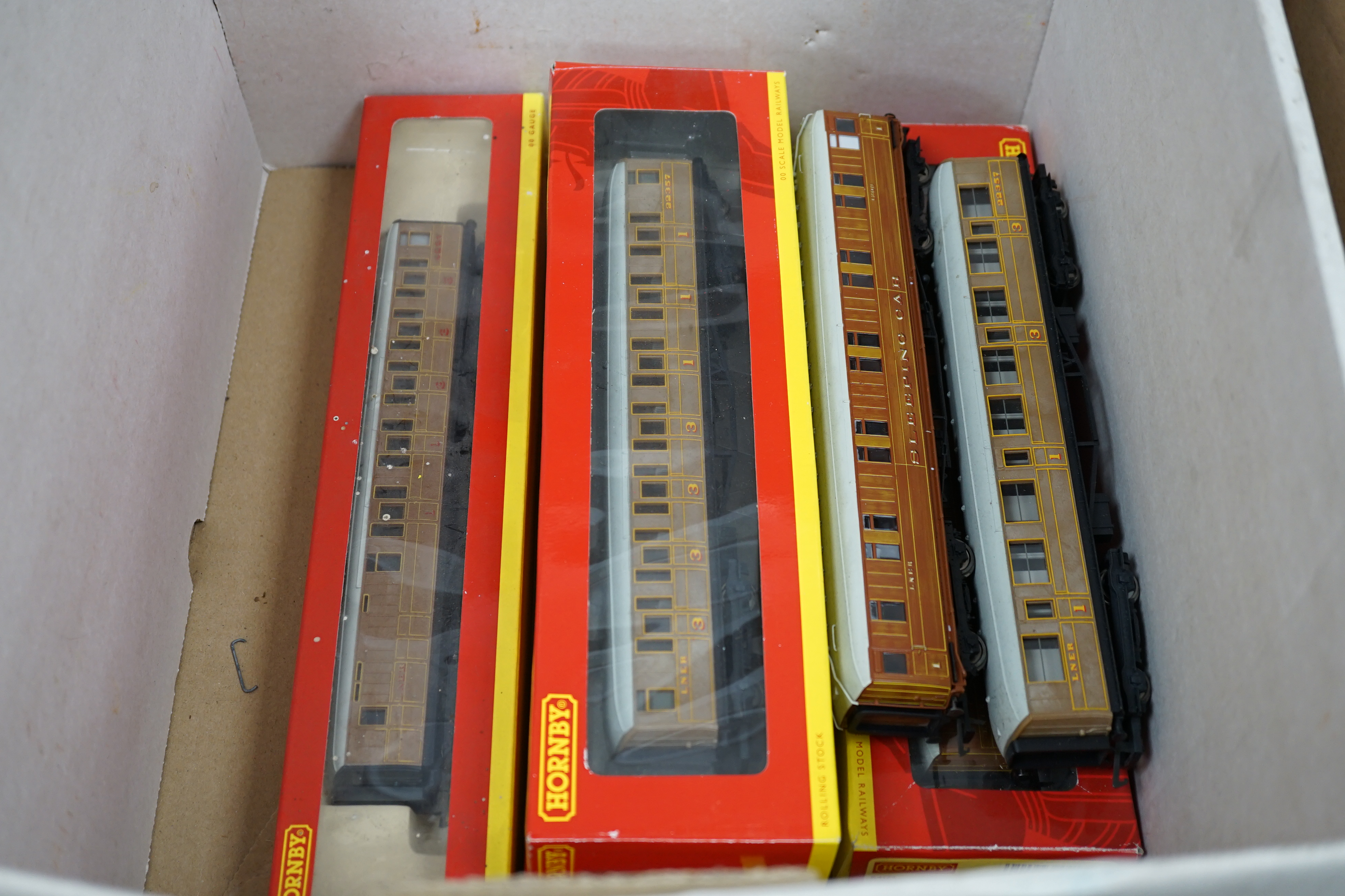 Nine Hornby 00 gauge LNER model railway items, including; a Flying Scotsman train set (R1019) comprising of Flying Scotsman and three teak coaches (missing some accessories and controllers), two additional tender locomot